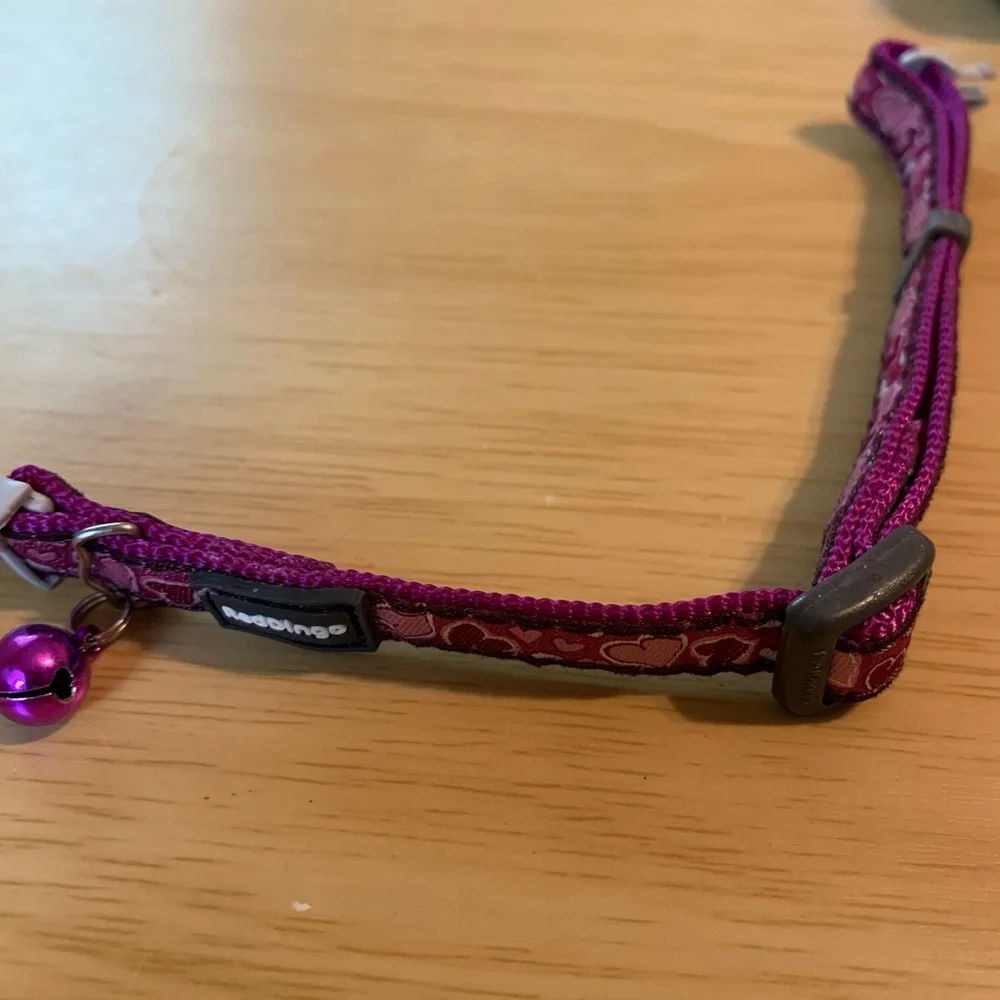 Brand new Purple Heart design cat collar has breakaway tan on collar purple bell